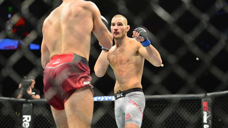 Oct 27, 2018; Moncton, Canada; Nordine Taleb (red gloves) fights Sean Strickland (blue gloves) during UFC Fight Night at Moncton Events Centre. Mandatory Credit: Trevor MacMillan-USA TODAY Sports