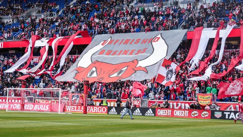 Mar 16, 2019; Harrison, NJ, USA; New York Red Bulls fans unveil a banner that reads "Unfinished Business" before the game against the San Jose Earthquakes at Red Bull Arena. Mandatory Credit: Vincent Carchietta-USA TODAY Sports