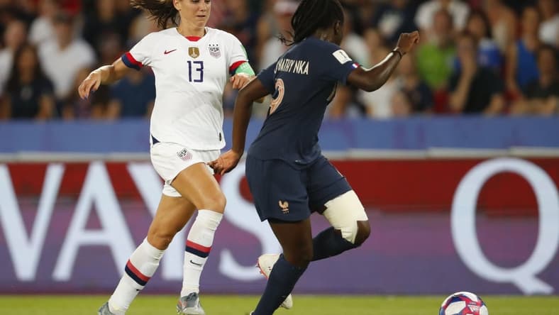 Jun 28, 2019; Paris, FRANCE; United States forward Alex Morgan (13) is defended by France defender Griedge Mbock Bathy (19) in the second half of a quarterfinal match in the FIFA Women's World Cup France 2019 at Parc des Princes. Mandatory Credit: Michael Chow-USA TODAY Sports Griedge Mbock Bathy