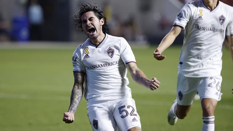 Sep 12, 2020; Sandy, Utah, USA; Colorado Rapids midfielder Braian Galvan (52) celebrates his second half goal with midfielder Cole Bassett (26) against the Real Salt Lake at Rio Tinto Stadium. Mandatory Credit: Jeffrey Swinger-USA TODAY Sports