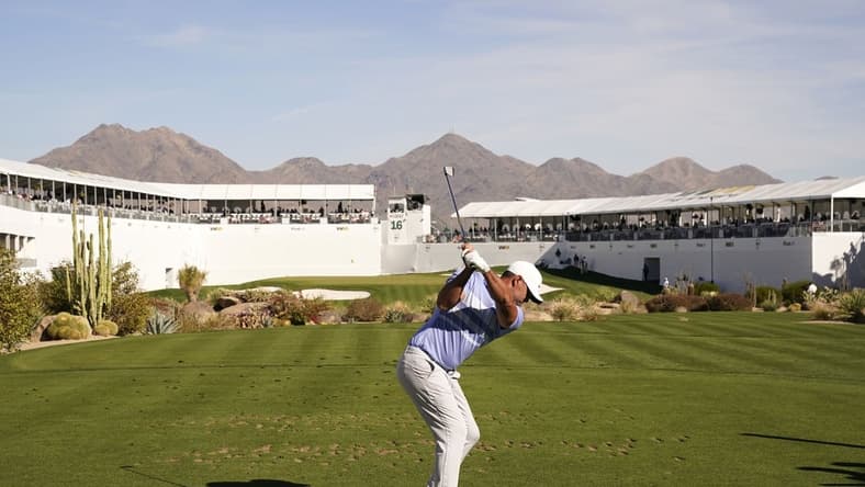 Feb 7, 2021; Scottsdale, Arizona, USA; Brooks Koepka plays his tee shot on the 16th hole during the final round of the Waste Management Phoenix Open at TPC Scottsdale. Mandatory Credit: Rob Schumacher-USA TODAY Sports