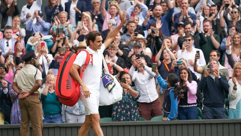 Jul 7, 2021; London, United Kingdom; Roger Federer (SUI) waving farewell to the Centre Court fans after losing to Hubert Hurkacz (POL) in the quarter finals at All England Lawn Tennis and Croquet Club. Mandatory Credit: Peter van den Berg-USA TODAY Sports