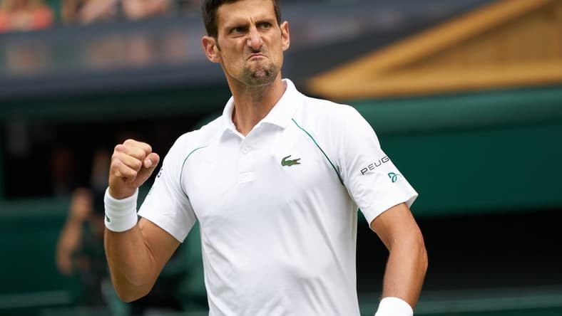 Jul 11, 2021; London, United Kingdom;  Novak Djokovic (SRB) seen with a passionate expression while playing against Matteo Berrettini (ITA) in the men s final on Centre Court at All England Lawn Tennis and Croquet Club. Mandatory Credit: Peter van den Berg-USA TODAY Sports