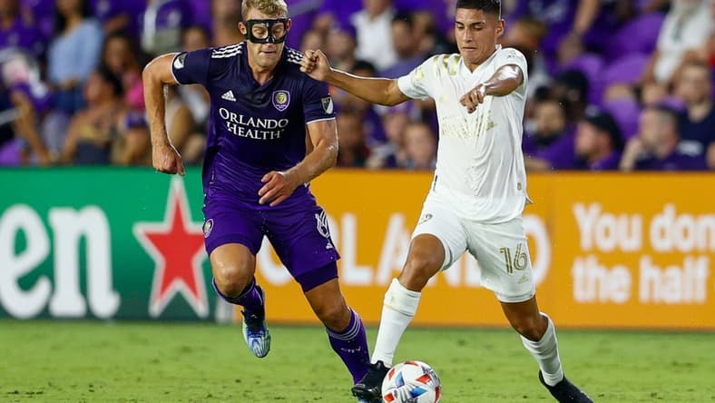 Jul 30, 2021; Orlando, Florida, USA; Atlanta United forward Erik Lopez (16) controls the ball past Orlando City defender Robin Jansson (6) in the first half at Orlando City Stadium. Mandatory Credit: Nathan Ray Seebeck-USA TODAY Sports