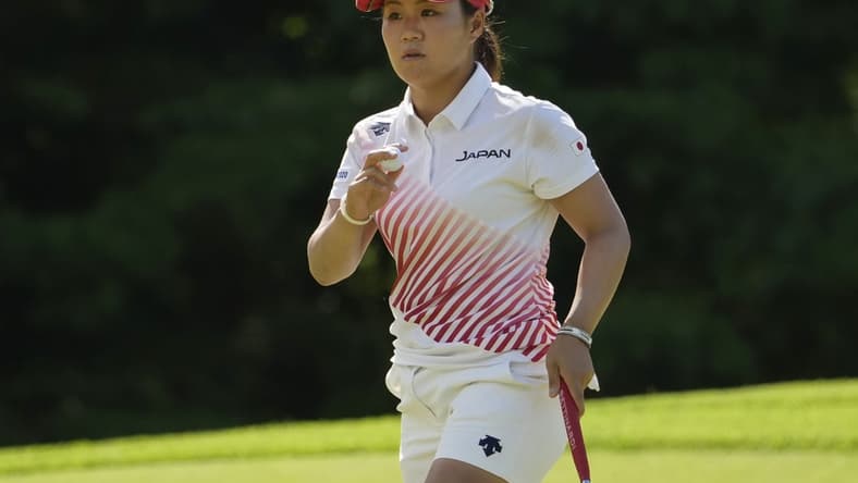 Aug 7, 2021; Tokyo, Japan; Nasa Hataoka (JPN) reacts after putting on the fourth hole during the final round of the women's individual stroke play of the Tokyo 2020 Olympic Summer Games at Kasumigaseki Country Club. Mandatory Credit: Michael Madrid-USA TODAY Sports