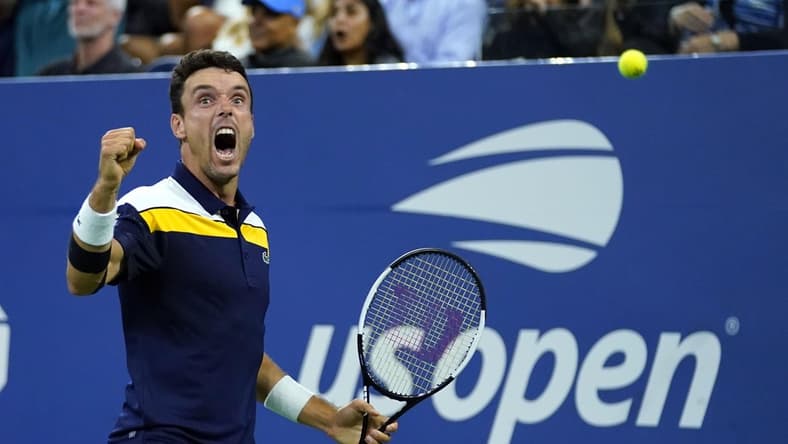 Sep 3, 2021; Flushing, NY, USA; Roberto Bautista Agut of Spain reacts as he wins the fourth set against Felix Auger-Aliassime of Canada on day five of the 2021 U.S. Open tennis tournament at USTA Billie Jean King National Tennis Center. Mandatory Credit: Danielle Parhizkaran-USA TODAY Sports