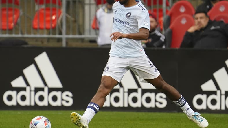 Oct 3, 2021; Toronto, Ontario, CAN; Chicago Fire defender Johan Kappelhof (4) passes the ball against Toronto FC during the first half at BMO Field. Mandatory Credit: John E. Sokolowski-USA TODAY Sports