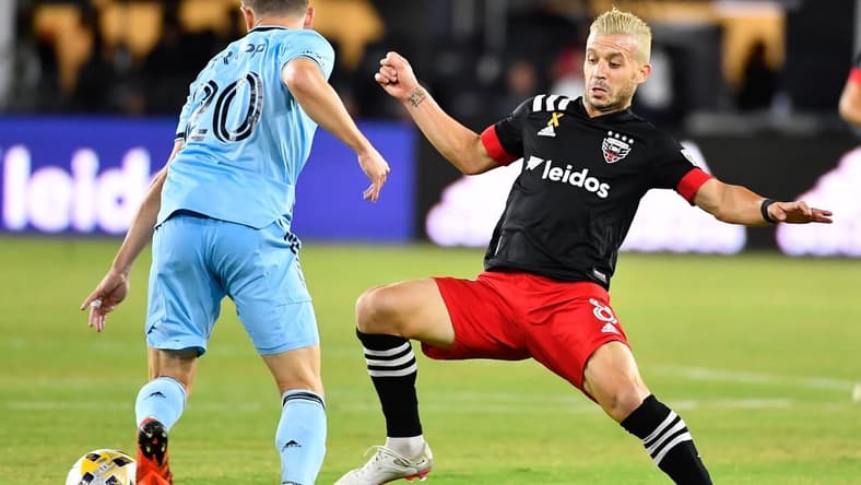Sep 29, 2021; Washington, District of Columbia, USA; Minnesota United midfielder Jan Gregus (8) possesses the ball as D.C. United midfielder Felipe Martins (8) defends during the first half at Audi Field. Mandatory Credit: Brad Mills-USA TODAY Sports