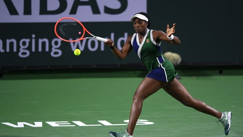 Oct 8, 2021; Indian Wells, CA, USA; Sloane Stephens (USA) hits a shot against Jessica Pegula (USA) at Indian Wells Tennis Garden. Mandatory Credit: Orlando Ramirez-USA TODAY Sports