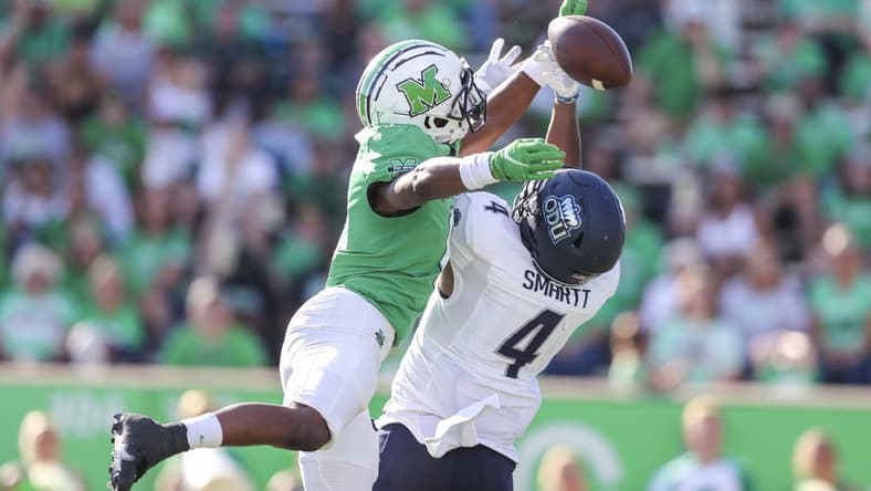 Oct 9, 2021; Huntington, West Virginia, USA; Marshall Thundering Herd defensive back Micah Abraham (6) breaks up a pass intended for Old Dominion Monarchs quarterback Stone Smartt (4) during the third quarter at Joan C. Edwards Stadium. Mandatory Credit: Ben Queen-USA TODAY Sports