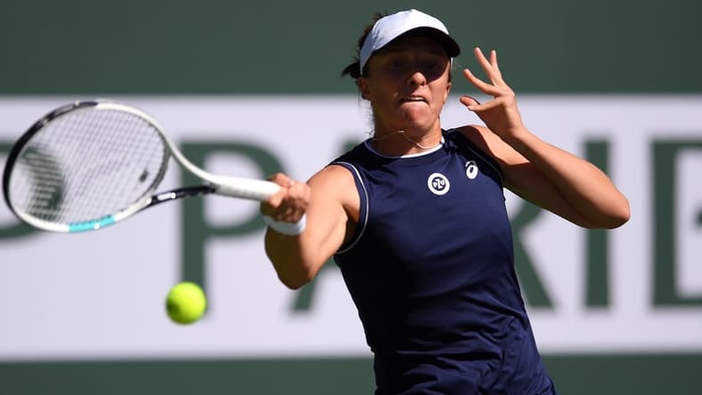 Oct 10, 2021; Indian Wells, CA, USA; Iga Swiatek (POL) hits a shot against Veronika Kudermetova (RUS) at Indian Wells Tennis Garden. Mandatory Credit: Orlando Ramirez-USA TODAY Sports