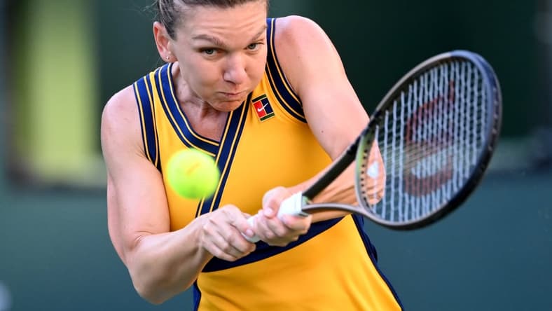 Oct 10, 2021; Indian Wells, CA, USA; Simona Halep (ROU) hits a shot in her second round match against Aliaksandra Sasnovich (BLR) during the BNP Paribas Open at the Indian Wells Tennis Garden. Mandatory Credit: Jayne Kamin-Oncea-USA TODAY Sports