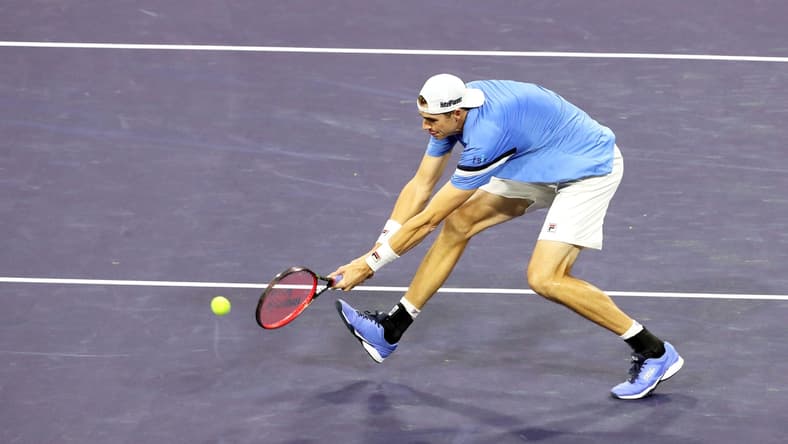 American John Isner returns a shot to Yoshihito Nishioka of Japan during the BNP Paribas Open in Indian Wells, Calif., on October 10, 2021.

John Isner Vs Yoshihito Nishioka Bnp Paribas2073