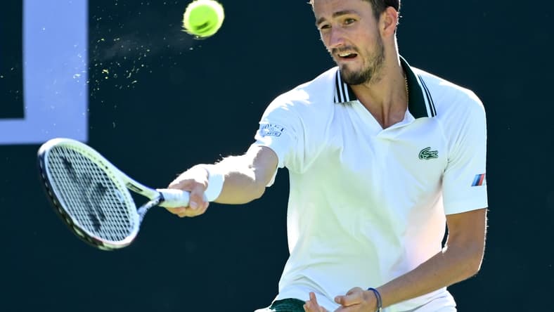 Oct 13, 2021; Indian Wells, CA, USA; Daniil Medvedev (RUS) hits a shot against Grigor Dimitrov (BUL) in his fourth round match during the BNP Paribas Open at the Indian Wells Tennis Garden. Mandatory Credit: Jayne Kamin-Oncea-USA TODAY Sports