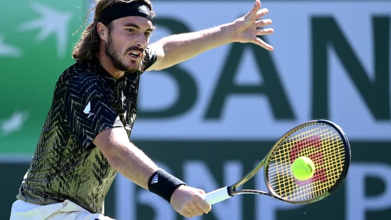 Oct 15, 2021; Indian Wells, CA, USA;   Stefanos Tsitsipas (GRE)hits a shot during his quarter final match against Nikoloz Basilashvili (GEO) during the BNP Paribas Open at the Indian Wells Tennis Garden. Mandatory Credit: Jayne Kamin-Oncea-USA TODAY Sports