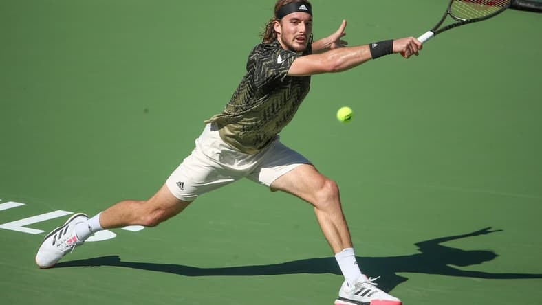 Stefanos Tsitsipas hits a shot against Nikoloz Basilashvili during their quarterfinal match at the BNP Paribas Open in Indian Wells, October 15, 2021.

Bnp Friday 27