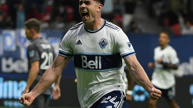 Oct 27, 2021; Vancouver, British Columbia, CAN; Vancouver Whitecaps forward Brian White (24) scores against Minnesota United FC goalkeeper Tyler Miller (1) (not pictured) during the second half at BC Place. Mandatory Credit: Anne-Marie Sorvin-USA TODAY Sports