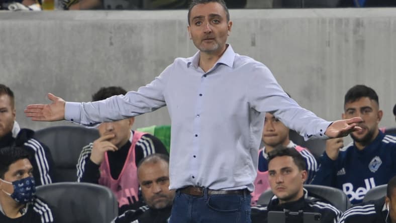 Nov 2, 2021; Los Angeles, California, USA;  Vancouver Whitecaps head coach Vanni Sartini yells from the sidelines in the first half at Banc of California Stadium. Mandatory Credit: Jayne Kamin-Oncea-USA TODAY Sports
