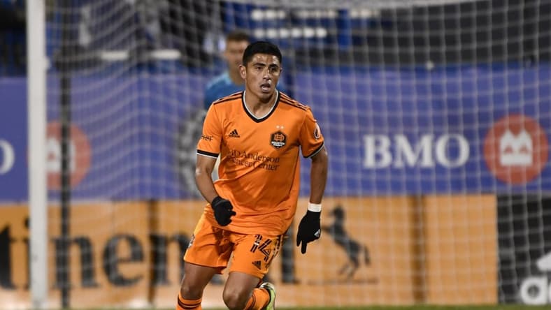 Nov 3, 2021; Montreal, Quebec, CAN; Houston Dynamo FC midfielder Joe Corona (14) plays the ball during the second half against the CF Montreal at Stade Saputo. Mandatory Credit: Eric Bolte-USA TODAY Sports