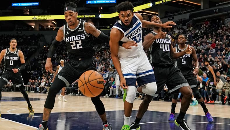 Nov 17, 2021; Minneapolis, Minnesota, USA; Sacramento Kings center Richaun Holmes (22) and Minnesota Timberwolves center Karl-Anthony Towns (32) at Target Center. Mandatory Credit: Nick Wosika-USA TODAY Sports