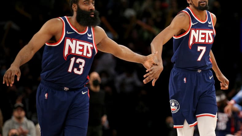 Dec 3, 2021; Brooklyn, New York, USA; Brooklyn Nets forward Kevin Durant (7) celebrates with guard James Harden (13) after a basket against the Minnesota Timberwolves during the fourth quarter at Barclays Center. Mandatory Credit: Brad Penner-USA TODAY Sports