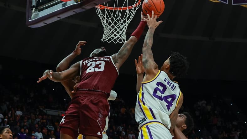 Jan 26, 2022; Baton Rouge, Louisiana, USA; Texas A&M Aggies guard Tyrece Radford (23) goes for a rebound against LSU Tigers forward Shareef O'Neal (24) during the second half at the Pete Maravich Assembly Center. Mandatory Credit: Stephen Lew-USA TODAY Sports