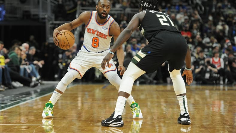 Jan 28, 2022; Milwaukee, Wisconsin, USA; New York Knicks guard Kemba Walker (8) brings the ball up the court against Milwaukee Bucks guard Jrue Holiday (21) in the second half at Fiserv Forum. Mandatory Credit: Michael McLoone-USA TODAY Sports