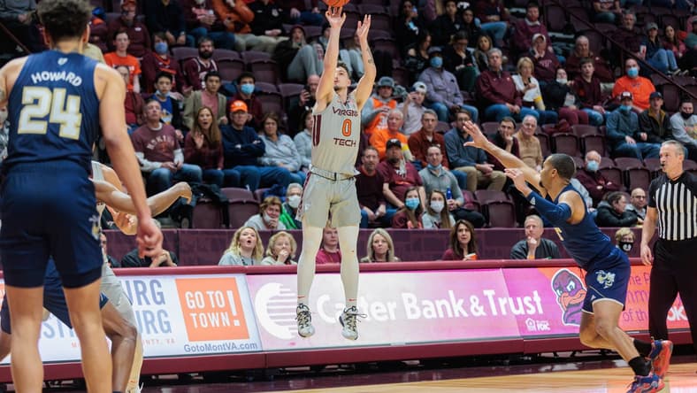 Feb 2, 2022; Blacksburg, Virginia, USA; Virginia Tech Hokies guard Hunter Cattoor (0) shoots against the Georgia Tech Yellow Jackets during the first half at Cassell Coliseum. Mandatory Credit: Ryan Hunt-USA TODAY Sports