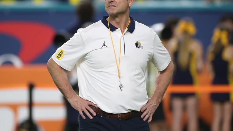 Michigan coach Jim Harbaugh watched his team warm up before the Orange Bowl against Georgia on Friday, Dec. 31, 2021, in Miami Gardens, Florida.
Capital One Orange Bowl