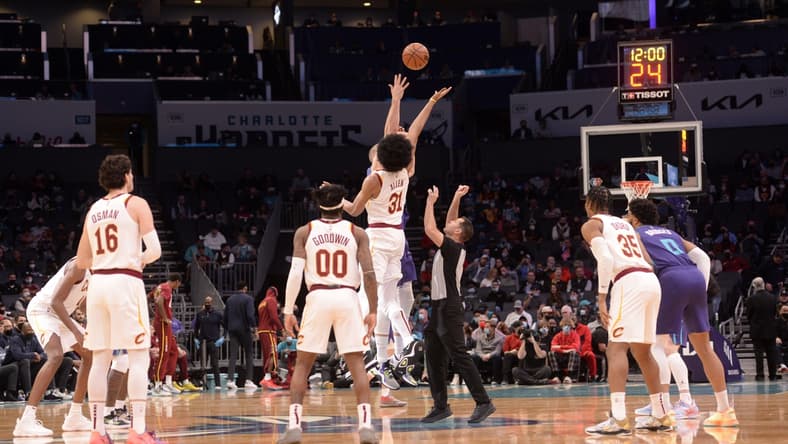 Feb 4, 2022; Charlotte, North Carolina, USA;  Cleveland Cavaliers center Jarrett Allen (31) and Charlotte Hornets center Mason Plumlee (24) tip off the game at the Spectrum Center. Mandatory Credit: Sam Sharpe-USA TODAY Sports