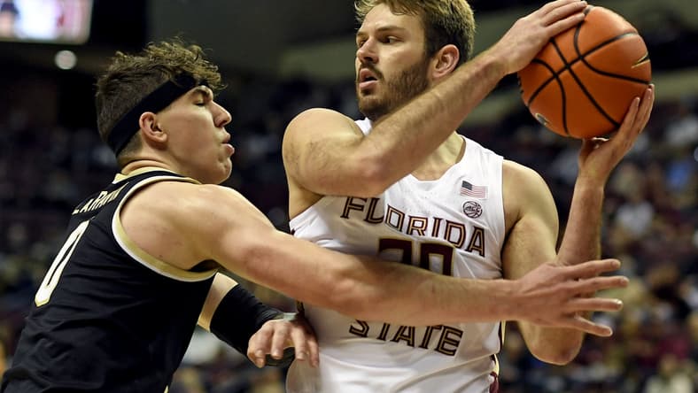 Feb 5, 2022; Tallahassee, Florida, USA; Florida State Seminoles forward Harrison Prieto (30) protects the ball from Wake Forest Deamon Deacons forward Jake Laravia (0) during the game at Donald L. Tucker Center. Mandatory Credit: Melina Myers-USA TODAY Sports