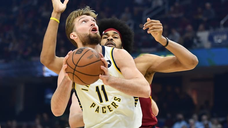 Feb 6, 2022; Cleveland, Ohio, USA; Indiana Pacers forward Domantas Sabonis (11) drives to the basket against Cleveland Cavaliers center Jarrett Allen (31) during the first quarter at Rocket Mortgage FieldHouse. Mandatory Credit: Ken Blaze-USA TODAY Sports