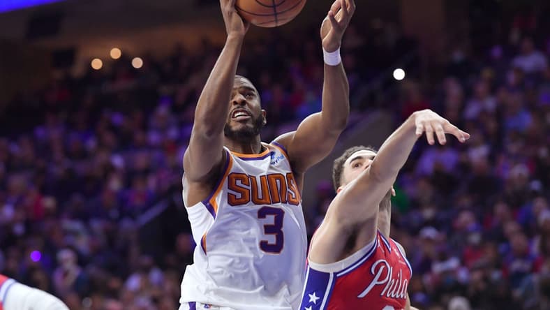 Feb 8, 2022; Philadelphia, Pennsylvania, USA; Phoenix Suns guard Chris Paul (3) drives to the basket past Philadelphia 76ers forward Georges Niang (20) during the fourth quarter at Wells Fargo Center. Mandatory Credit: Eric Hartline-USA TODAY Sports