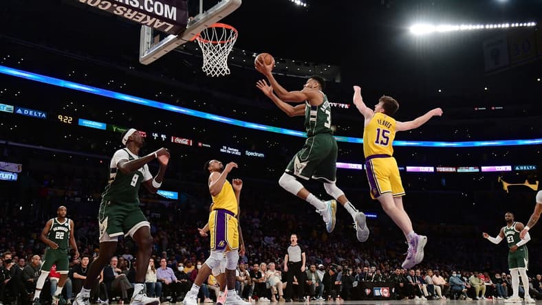 Feb 8, 2022; Los Angeles, California, USA; Milwaukee Bucks forward Giannis Antetokounmpo (34) moves to the basket ahead of Los Angeles Lakers guard Austin Reaves (15) during the second half at Crypto.com Arena. Mandatory Credit: Gary A. Vasquez-USA TODAY Sports
