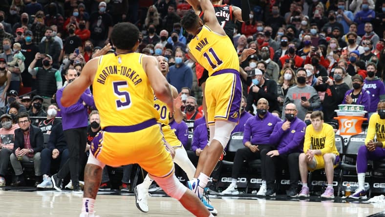 Feb 9, 2022; Portland, Oregon, USA; Portland Trail Blazers guard Anfernee Simons (1) shoots over Los Angeles Lakers guard Malik Monk (11) in the second half at Moda Center. Mandatory Credit: Jaime Valdez-USA TODAY Sports