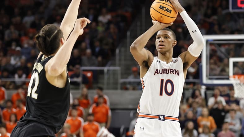 Feb 16, 2022; Auburn, Alabama, USA; Auburn Tigers forward Jabari Smith (10) takes a shot against Vanderbilt Commodores forward Quentin Millora-Brown (42) during the second half at Auburn Arena. Smith led all scoring with 31 points. Mandatory Credit: John Reed-USA TODAY Sports