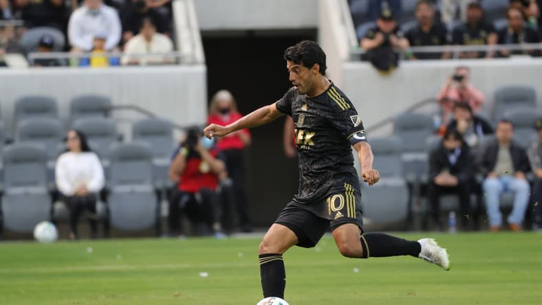 Feb 26, 2022; Los Angeles, California, USA; Los Angeles FC forward Carlos Vela (10) scores a penalty kick in the first half against the Colorado Rapids at Banc of California Stadium. Mandatory Credit: Kiyoshi Mio-USA TODAY Sports