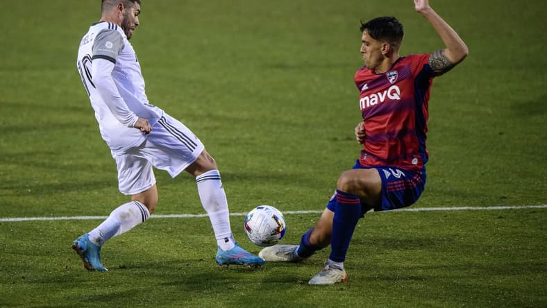 Feb 26, 2022; Frisco, Texas, USA; FC Dallas defender Jose Antonio Martinez (3) defends against Toronto FC midfielder Alejandro Pozuelo (10) during the second half of their MLS match at Toyota Stadium. Upon VAR review the call for a penalty kick was overturned. Mandatory Credit: Jerome Miron-USA TODAY Sports