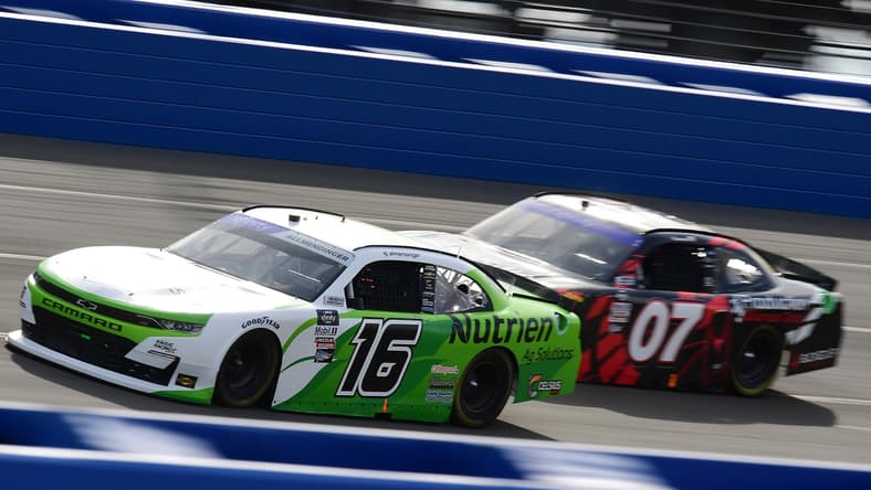 Feb 26, 2022; Fontana, California, USA; Xfinity Series driver AJ Allmendinger (16) and Xfinity Series driver Cole Custer (07) race for position during the Production Alliance Group 300 at Auto Club Speedway. Mandatory Credit: Gary A. Vasquez-USA TODAY Sports
