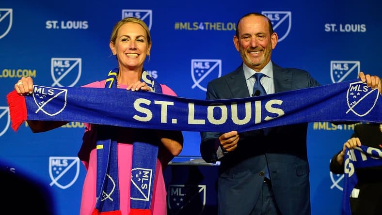 Aug 20, 2019; St. Louis, MO, USA; MLS commissioner Don Garber places poses for a photo with ownership group leader Carolyn Kindle Betz after announcing an expansion team for St. Louis at The Palladium. Mandatory Credit: Jeff Curry-USA TODAY Sports