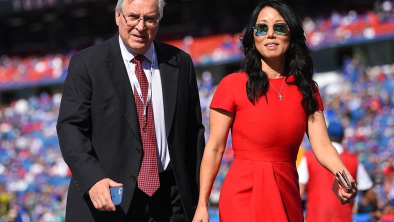 Oct 20, 2019; Orchard Park, NY, USA; Buffalo Bills owners Terry and Kim Pegula walk on the field prior to the game against the Miami Dolphins at New Era Field. Mandatory Credit: Rich Barnes-USA TODAY Sports