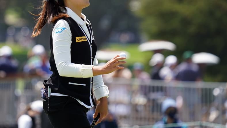 Jun 5, 2021; San Francisco, California, USA; In Gee Chun waves after her putt on the tenth green during the third round of the U.S. Women's Open golf tournament at The Olympic Club. Mandatory Credit: Kyle Terada-USA TODAY Sports