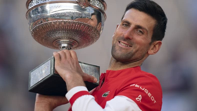 Jun 13, 2021; Paris, France; Novak Djokovic (SRB) poses with the trophy after winning the men's final against Stefanos Tsitsipas (GRE) on day 15 of the French Open at Stade Roland Garros. Mandatory Credit: Susan Mullane-USA TODAY Sports