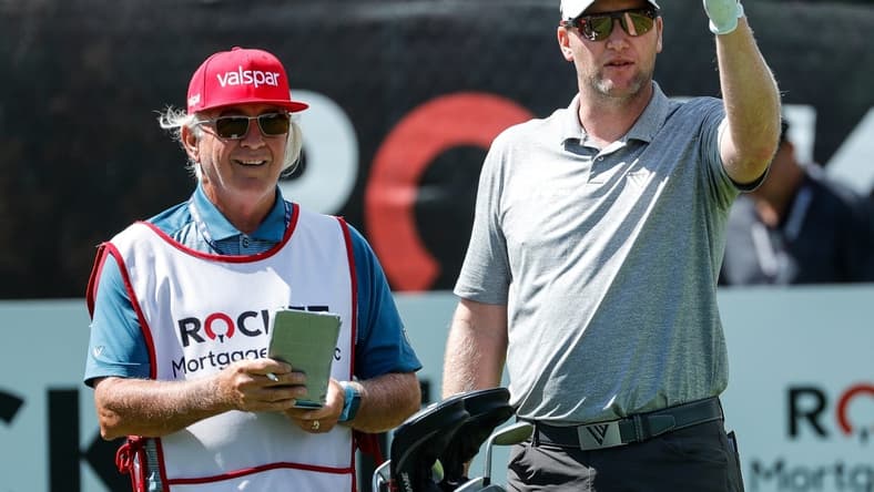 Ryan Brehm talks to his caddie before teeing off on the eighth in the second round of the Rocket Mortgage Classic at the Detroit Golf Club in Detroit on Friday, July 2, 2021.