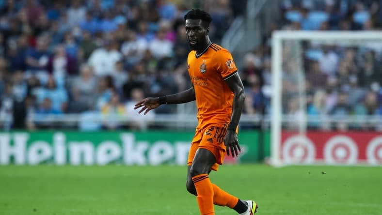Aug 7, 2021; Saint Paul, MN, USA; Houston Dynamo midfielder Derrick Jones (21) dribbles the ball against Minnesota United in the first half at Allianz Field. Mandatory Credit: David Berding-USA TODAY Sports