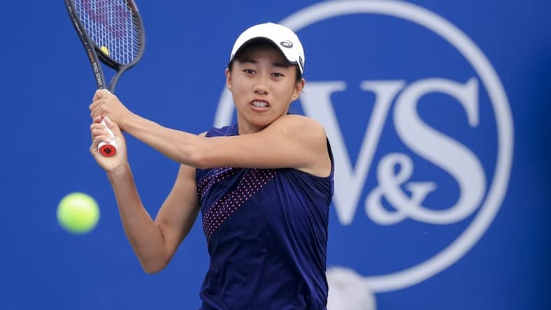 Aug 15, 2021; Mason, OH, USA; Shuai Zhang (CHN) returns a shot against Marie Bouzkova (CZE) during the Western and Southern Open tennis tournament at Lindner Family Tennis Center. Mandatory Credit: Aaron Doster-USA TODAY Sports