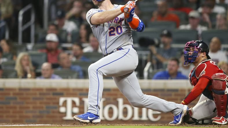 Oct 1, 2021; Atlanta, Georgia, USA; New York Mets first baseman Pete Alonso (20) hits a double against the Atlanta Braves in the fourth inning at Truist Park. Mandatory Credit: Brett Davis-USA TODAY Sports