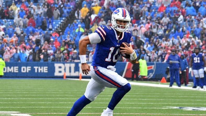 Oct 3, 2021; Orchard Park, New York, USA; Buffalo Bills quarterback Mitchell Trubisky (10) runs for a touchdown in the fourth quarter against the Houston Texans at Highmark Stadium. Mandatory Credit: Mark Konezny-USA TODAY Sports