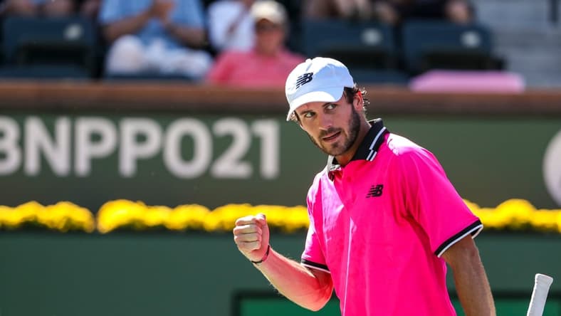 Tommy Paul of the United States celebrates a point against Cameron Norrie of Great Britain during their round four match of the BNP Paribas Open, Wednesday, Oct. 13, 2021, in Indian Wells, Calif.