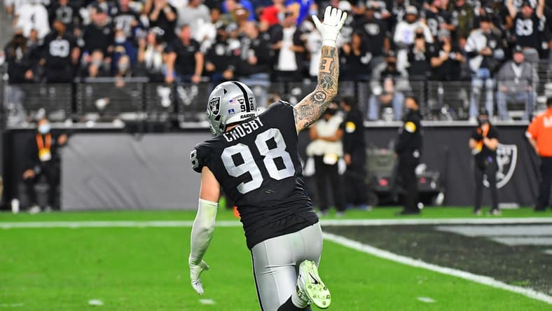 Jan 9, 2022; Paradise, Nevada, USA; Las Vegas Raiders defensive end Maxx Crosby (98) celebrates after sacking Los Angeles Chargers quarterback Justin Herbert (10) at Allegiant Stadium. Mandatory Credit: Stephen R. Sylvanie-USA TODAY Sports